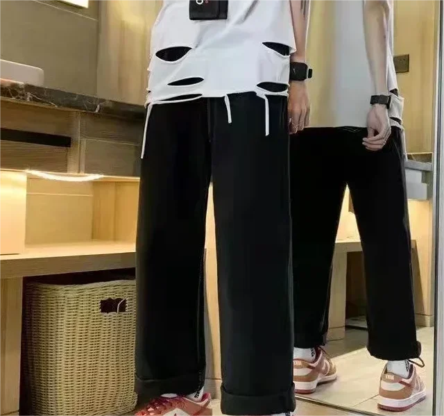 2025 new autumn and winter digital 3D printing ripped patch straight-tipped micro-flare printed jeans on the street